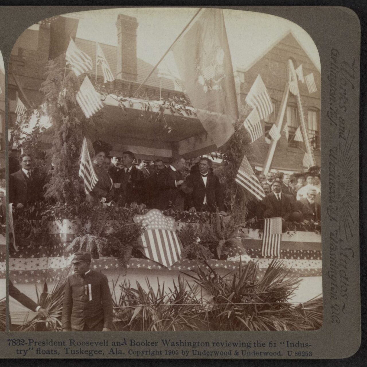 President Roosevelt, Booker T. Washington, and others review a parade in Tuskegee